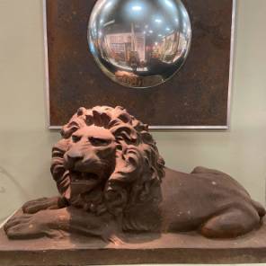A Pair Of Cast Iron Lions